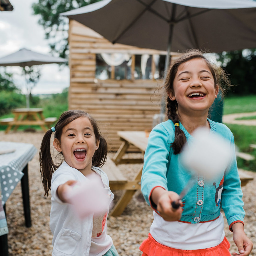 Low cost children's activities in the Cotswolds - 2 girls with marshmallows on sticks
