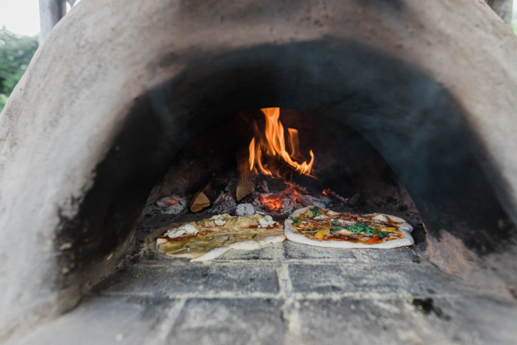 Pizzas cooking in the pizza oven