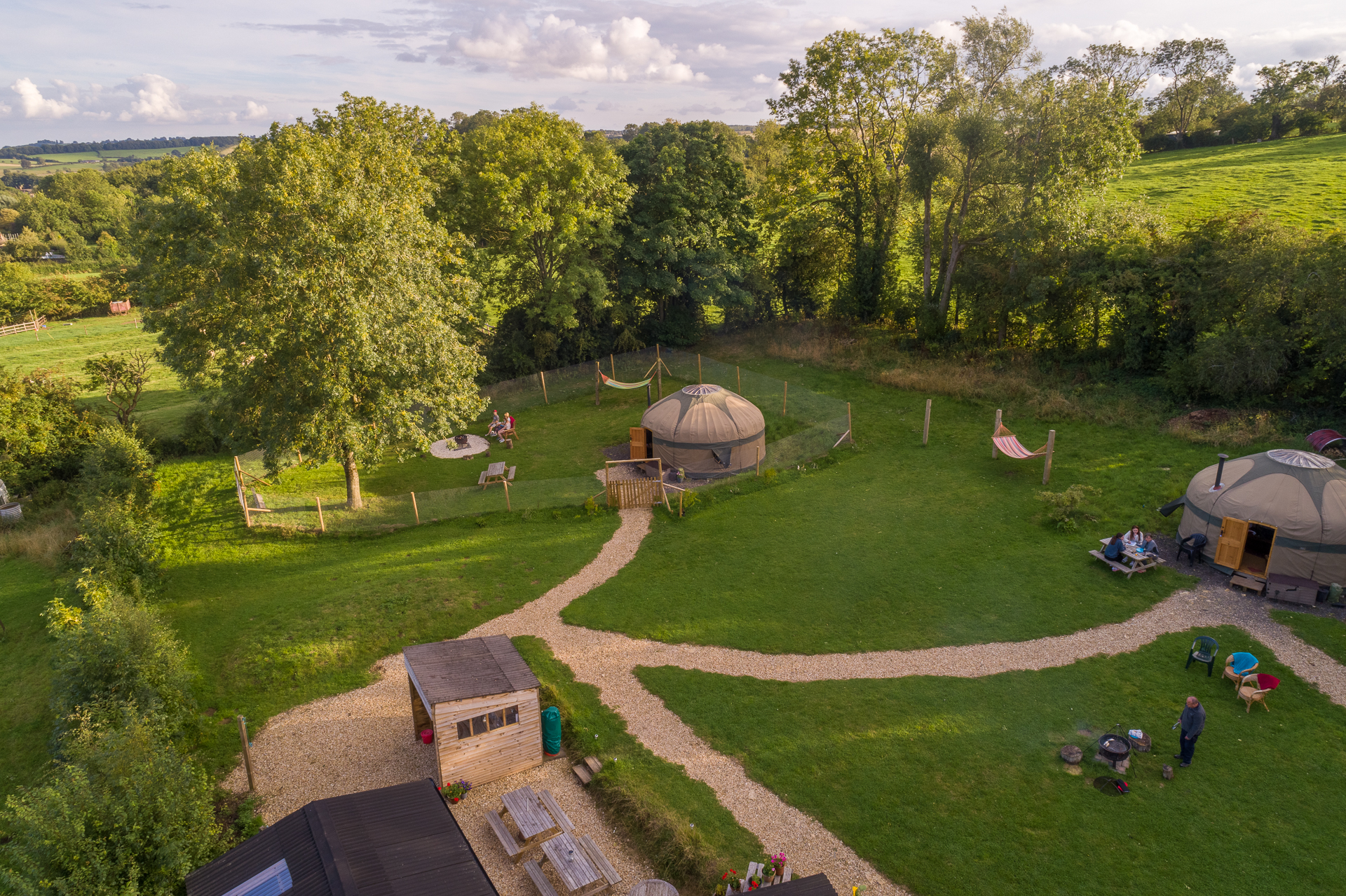 Aerial view of 2 yurts and grounds