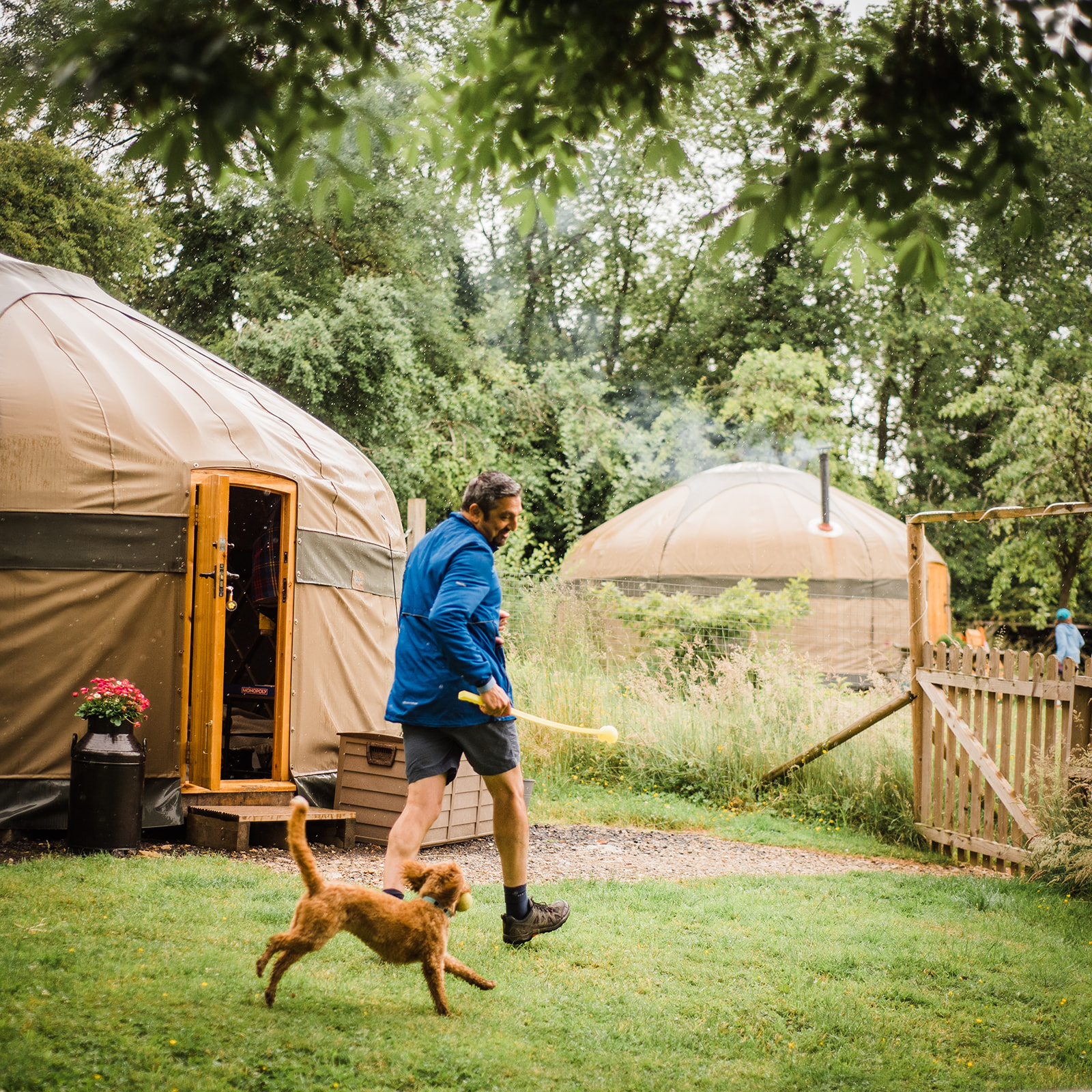 Dog friendly Cotswold holiday. Man and dog at a dog friendly yurt glamping site