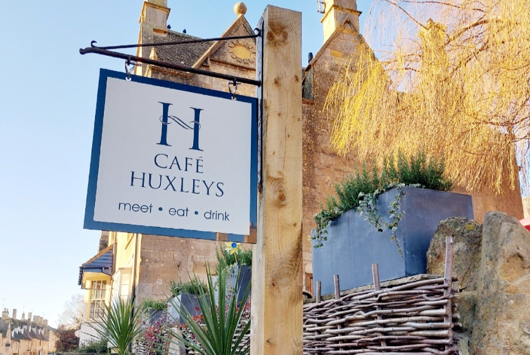 Sign for Huxleys cafe, one of the places to eat in Chipping Campden