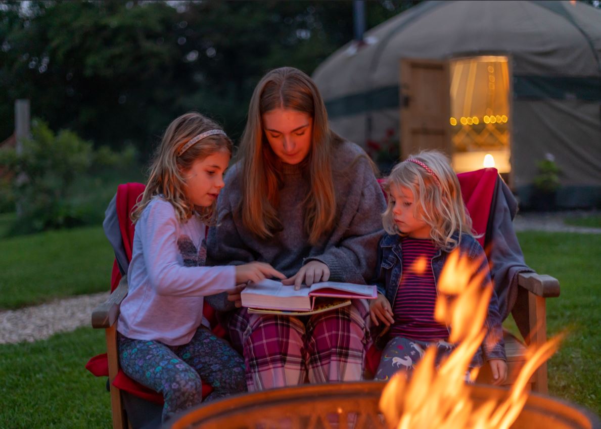 Family Friendly Glamping Stories with 3 girls around campfire