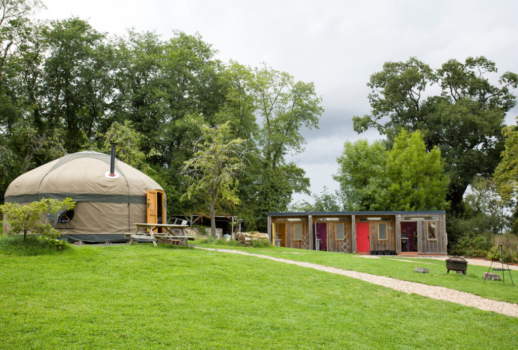 Family friendly glamping site with yurts and bathroom block close together