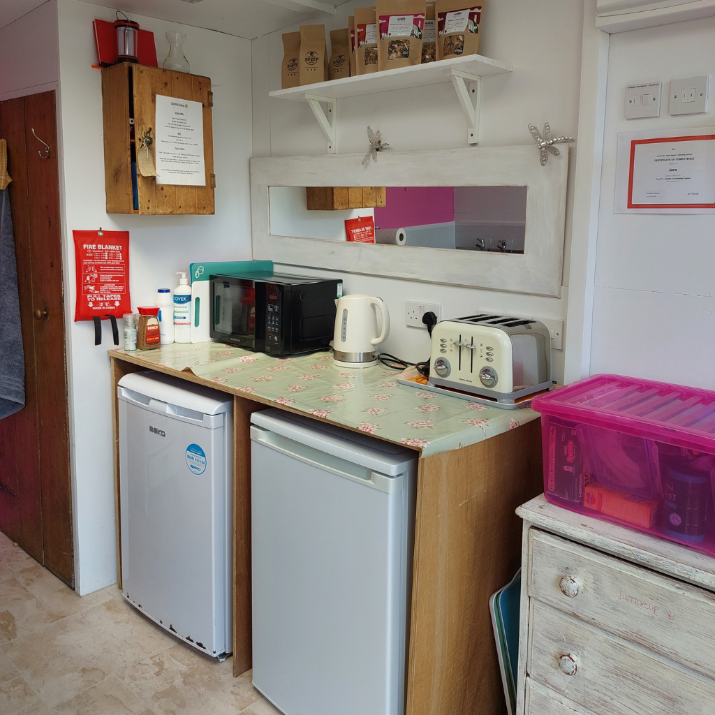 Family friendly glamping what is provided in the kitchen room: microwave, kettle, toaster and fridges