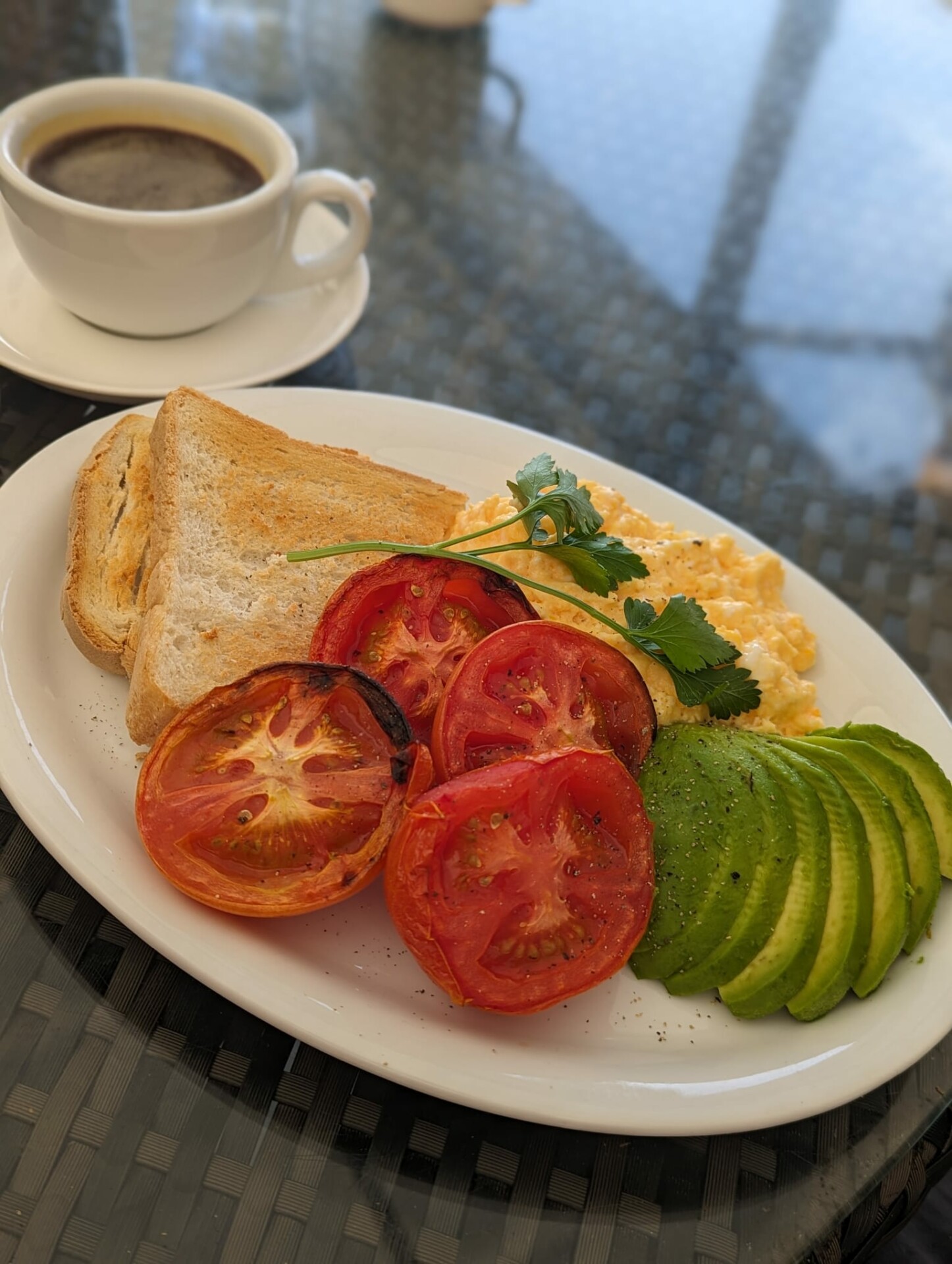 Breakfast at Vegetable matters Farm shop - toast, eggs, tomatoes and avocado