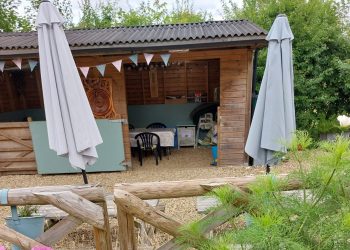 Accommodation includes the wooden shelter with tables and chairs